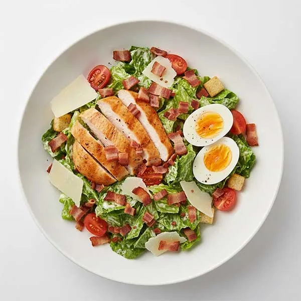 Smoked Chicken Caesar Salad with Boiled Egg, Parmesan Shaves, Fresh Tomato & Grilled Turkey Bacon